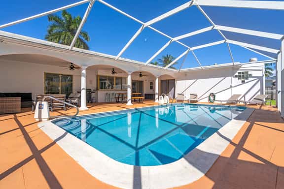 Bayfront Villa 4 BR with Heated Pool 10 min walk to Beach - Image 1